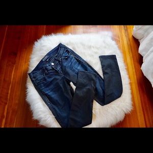 Dark wash skinny silver jeans.